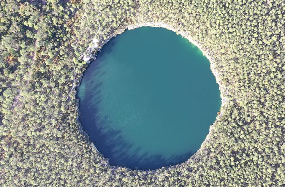 This Island in The Bahamas Has 200 Blue Holes, a National Park, and a Legendary Mystery